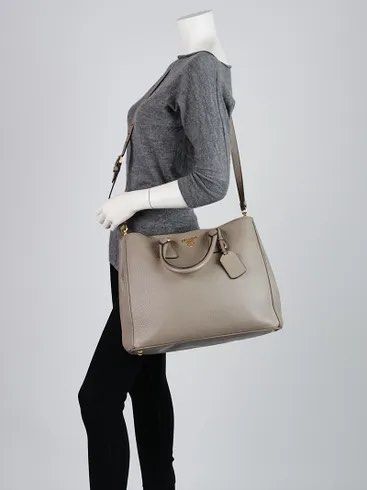 Auth Prada Vitello Daino Argilla (Category: Luxury Bags & Wallets) located in Antipolo. Submitted by authenticstuff4you (Listing ID 1361378407, Image 2). Description: Selling this lightly used Authentic Prada Vitello Daino Shopping Tote Bag in Argilla. I’m the first owner, bought in Hong Kong for around 100k. Exterior leather is still clean with just light wear. Interior is also clean and well maintained. Light wear at the bottom edges but nothin