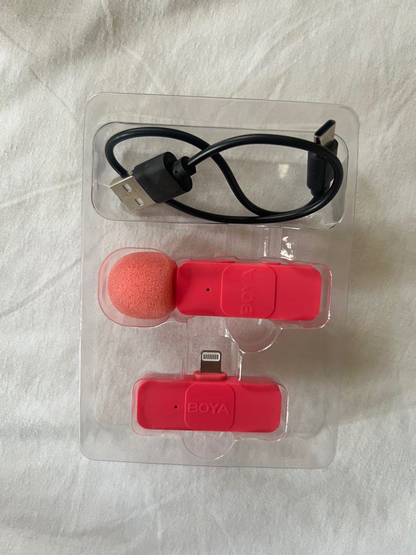 BOYA pink lapel wireless microphone lightning (Category: Microphones) located in Quezon City. Submitted by blairwearss (Listing ID 1361361788, Image 2). Description: -selling pink boya mic lightning -has a noise cancellation feature -slightly used—only used it for a month (in very good condition) -complete inclusions: mic, charging cord, and box -rfs: don’t need it anymore.