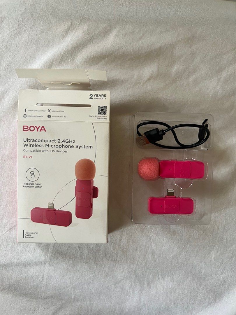 BOYA pink lapel wireless microphone lightning (Category: Microphones) located in Quezon City. Submitted by blairwearss (Listing ID 1361361788, Image 1). Description: -selling pink boya mic lightning -has a noise cancellation feature -slightly used—only used it for a month (in very good condition) -complete inclusions: mic, charging cord, and box -rfs: don’t need it anymore.