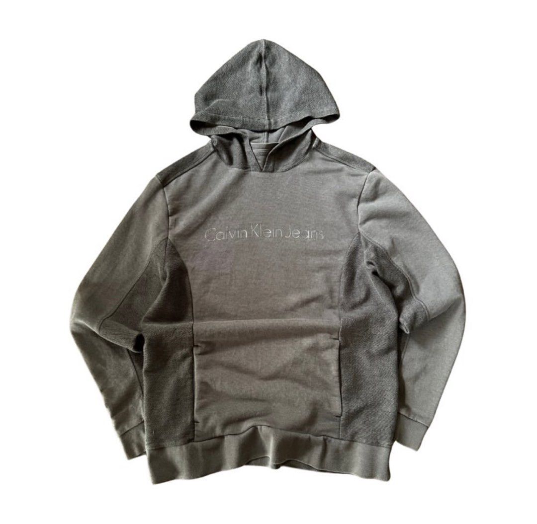 Calvin Klein hoodie (Category: Coats, Jackets and Outerwear) located in Binan City. Submitted by luckythriffs (Listing ID 1361415051, Image 1). Description: Calvin Klein Hoodie Condition: 9/10 Issues: stain ~Dimes~ M on tag Length: 27” Width: 20”.