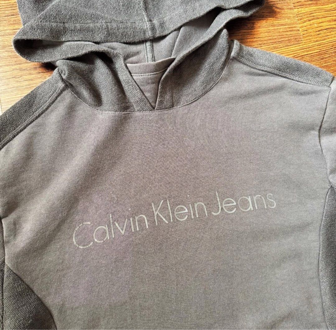 Calvin Klein hoodie (Category: Coats, Jackets and Outerwear) located in Binan City. Submitted by luckythriffs (Listing ID 1361415051, Image 2). Description: Calvin Klein Hoodie Condition: 9/10 Issues: stain ~Dimes~ M on tag Length: 27” Width: 20”.