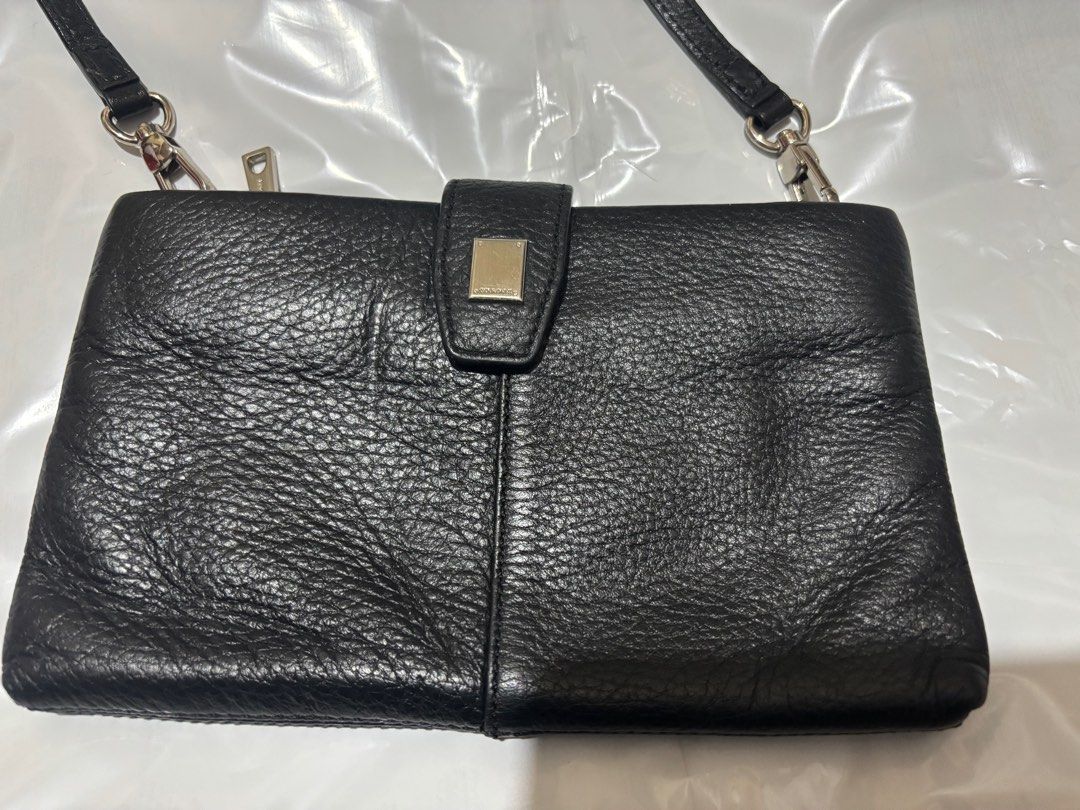 Courrone wallet sling (Category: Luxury Bags & Wallets) located in Makati City. Submitted by issa124 (Listing ID 1361478842, Image 2). Description: Courrone wallet sling. Pure leather. Preloved but still very nice. With short sling. Size :8x4.7 inches. .