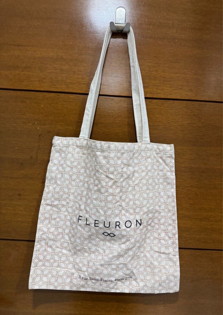 Fleuron tote bag (Category: Tote Bags) located in Manila. Submitted by chinchinshaven (Listing ID 1361461693, Image 1). Description: Good quality material Thick cloth Size width 38.5cm Height 39cm Bag strap height 34.5cm.