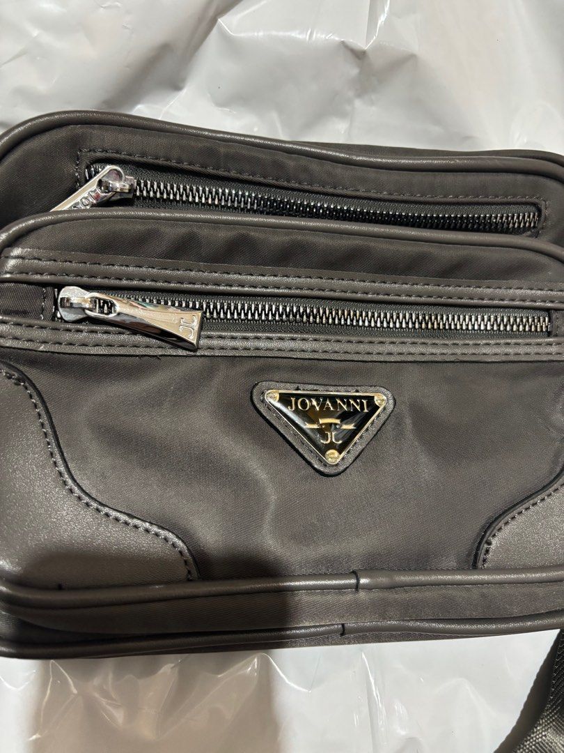 Jovanni Sling Bag (Category: Luxury Bags & Wallets) located in Makati City. Submitted by issa124 (Listing ID 1361482127, Image 2). Description: Jovanni Sling Bag. Used once only. Can pass as new. Lot of zipper compartments. Size :10x 5 inches.