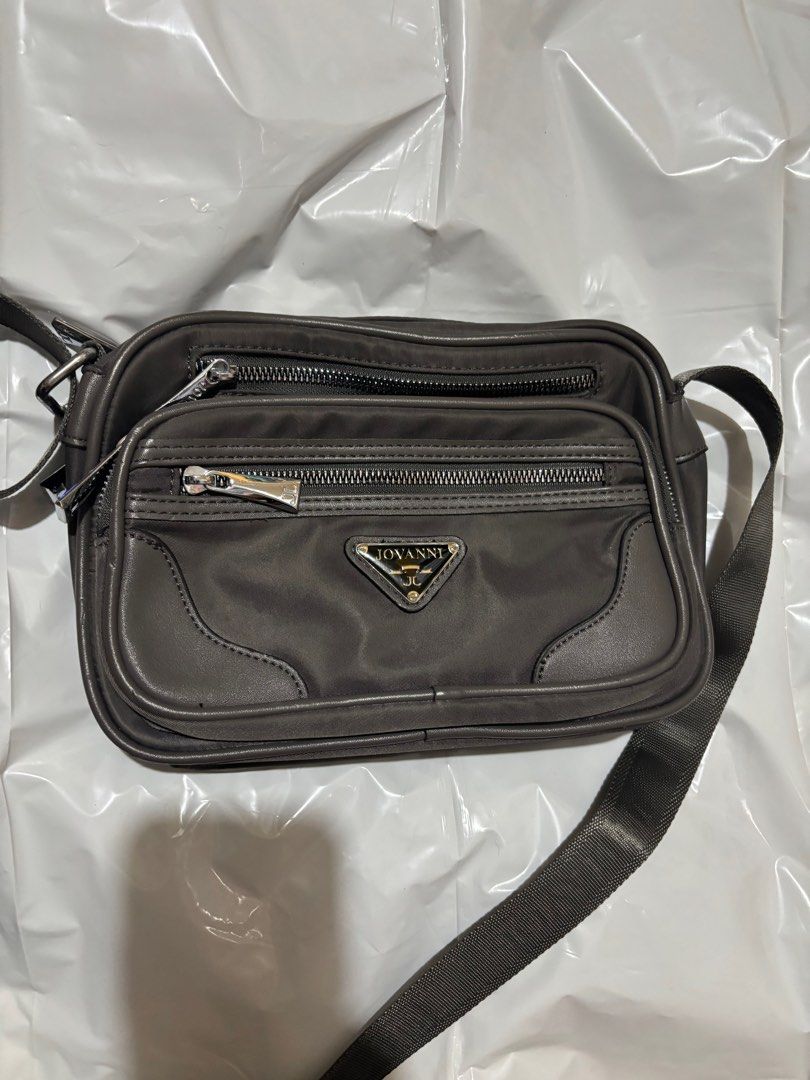 Jovanni Sling Bag (Category: Luxury Bags & Wallets) located in Makati City. Submitted by issa124 (Listing ID 1361482127, Image 1). Description: Jovanni Sling Bag. Used once only. Can pass as new. Lot of zipper compartments. Size :10x 5 inches.