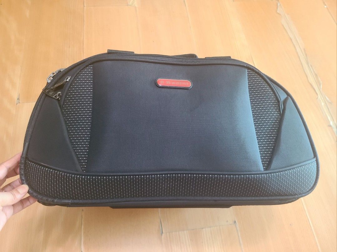 Racini hand carry luggage. (Category: Luggage) located in Taguig. Submitted by yeon0124 (Listing ID 1361386426, Image 3). Description: Racini hand carry luggage. two wheels, several pockets. - material: fabric like a bag. - Wight: 2kg. this is lighter than 4 wheels hand carry luggage. - no issue. - very good condition..