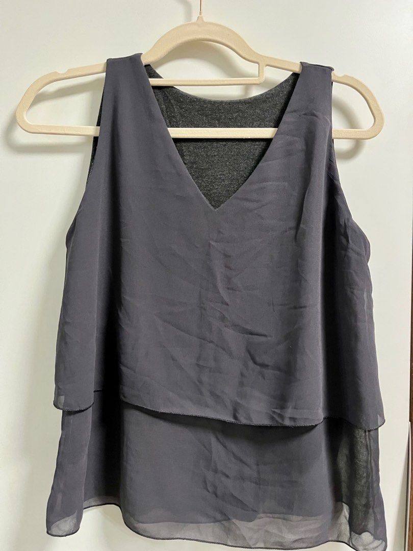 Sleeveless blouse (Category: Blouses) located in Taguig. Submitted by decluttering_my_stuff (Listing ID 1361426112, Image 2). Description: Formal sleeveless blouse in 2 colors (blue and gray) - lightly used, good condition - Free size - P150 each. buy 2 for P250 .