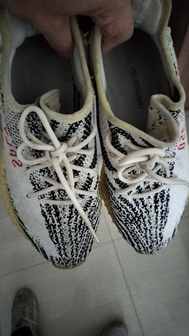 Yeezy 350 V2 Zebra (Category: Sneakers) located in Manila. Submitted by joean21 (Listing ID 1361392079, Image 2). Description: lowest price in the market! guaranteed authentic! RFS: too many shoes already issue: reglued soles and yellowing.
