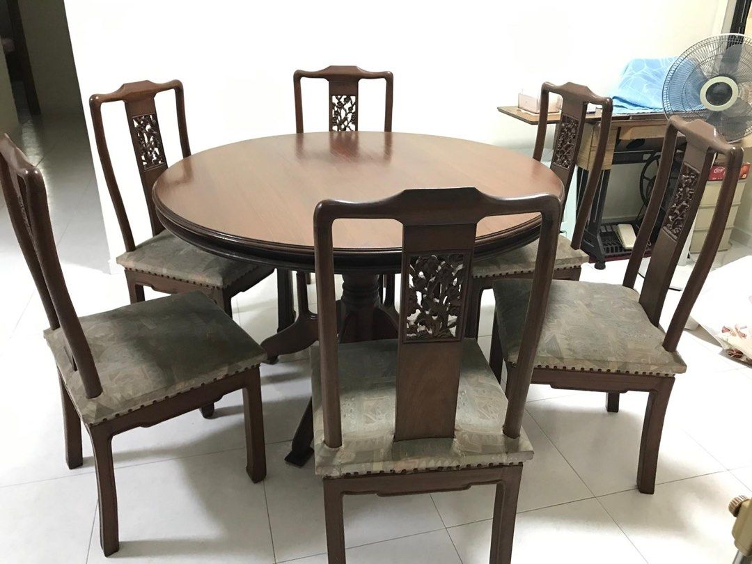 Dining Table Set (Category: Tables & Sets) located in Singapore. Submitted by litebreeze (Listing ID 1362842439, Image 1). Description: 6 antique-style hand-carved teak wood chairs (cushioned) with one dining table. Self collection at Jurong West please. .