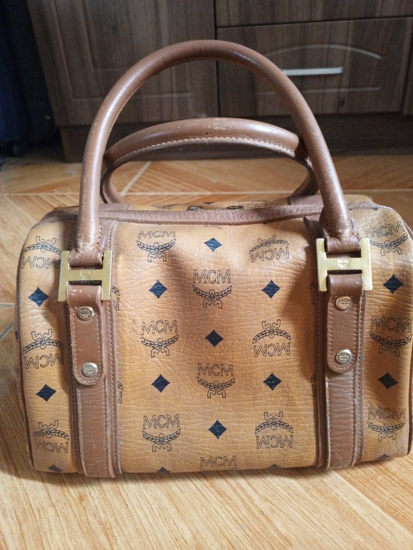 MCM cognac doctors bag handbag (Category: Luxury Bags & Wallets) located in Consolacion. Submitted by i.am.xs.or.s (Listing ID 1362902537, Image 3). Description: MCM munchen 02710 issue: leather coating fade scratches.