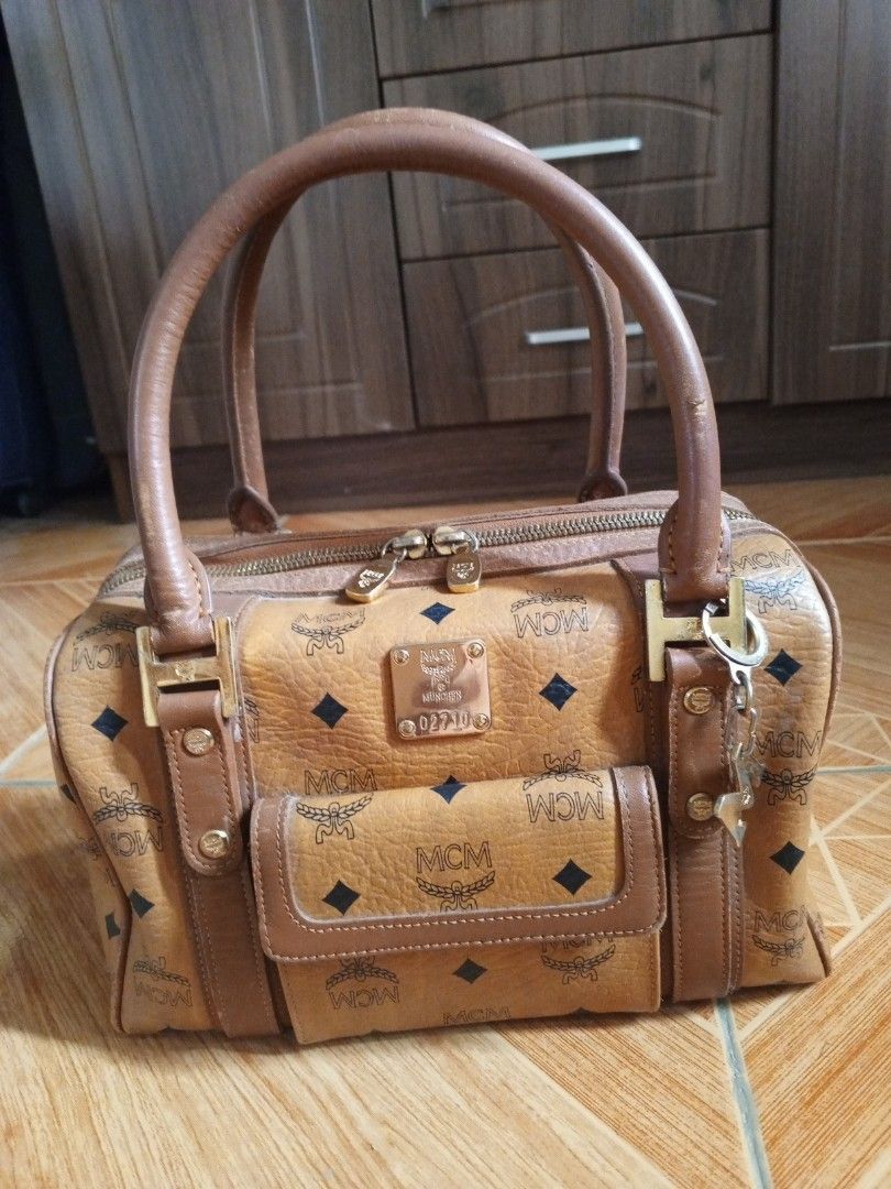 MCM cognac doctors bag handbag (Category: Luxury Bags & Wallets) located in Consolacion. Submitted by i.am.xs.or.s (Listing ID 1362902537, Image 1). Description: MCM munchen 02710 issue: leather coating fade scratches.