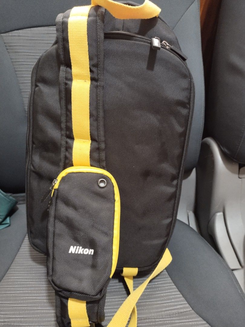 nikon camera & laptop backpack (Category: Backpacks) located in Baguio. Submitted by roozeydluc (Listing ID 1362988691, Image 2). Description: polyester material with foam inner back lining large size l:10" w:9" back h:14.5" front h:21.5" like new condition ✓1 laptop compartment ✓1 zippered compartment ✓2 zippered compartment shoulder strap pocket.