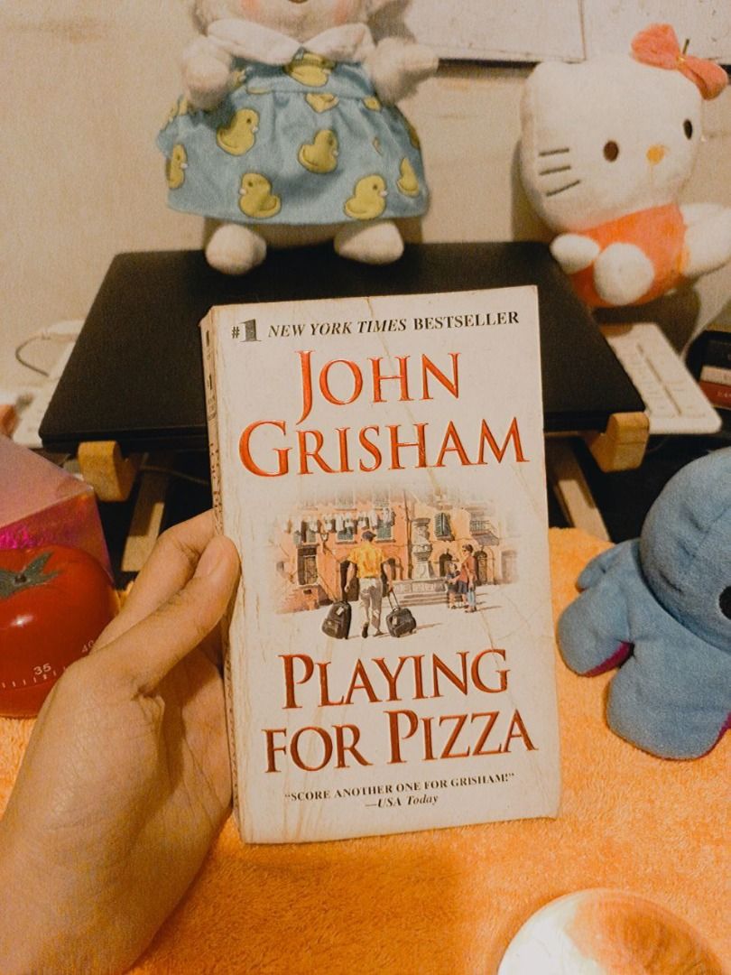Playing for Pizza | Novel by John Grisham (Category: Storybooks) located in Quezon City. Submitted by pixellea2 (Listing ID 1362989944, Image 1). Description: Playing for Pizza Novel by John Grisham PRELOVED BOOK 📚 ✨ May have flaws such as dents, tanning, foxing, writings, etc. PROMO 📣 ✨ Buy 5 books and get 50% off the 6th book! MODE OF DELIVERY & PAYMENT 📦 ✨ Payment via GCash only – strictly no COD ✨ Strictly for pickup via Lalamove only and/