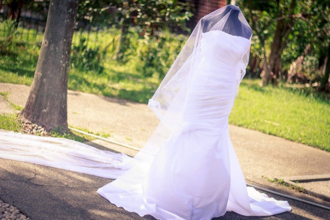 Serpentine-cut wedding gown (Category: Evening dresses & gowns) located in Cavite. Submitted by mdsmak (Listing ID 1362929201, Image 3). Description: Serpentine wedding gown With adjustable criss cross tie at the back 3-meters long trail Includes all accessories: veil, cord, coins, ring cushion, garter Issue: yellow stains in some parts due to the clip (washable).