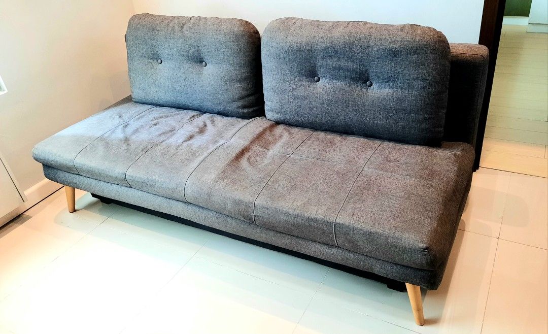 Sofabed with Storage (Category: Sofas) located in Quezon City. Submitted by new_and_good_as_new_items (Listing ID 1362996393, Image 1). Description: Fredrikstad Sofabed with Storage (Dark Gray) • Bought from Furniture Source Phils. • Product Dimensions: Length 195 cm Width 91 cm Height 89 cm Seat Height 41 cm Seat Depth 53 cm • 54 inches total depth when converted to bed. • bed feature not really used that much, this is why one side looks differe