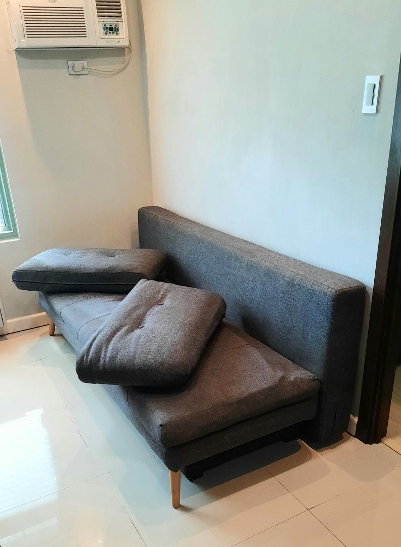 Sofabed with Storage (Category: Sofas) located in Quezon City. Submitted by new_and_good_as_new_items (Listing ID 1362996393, Image 2). Description: Fredrikstad Sofabed with Storage (Dark Gray) • Bought from Furniture Source Phils. • Product Dimensions: Length 195 cm Width 91 cm Height 89 cm Seat Height 41 cm Seat Depth 53 cm • 54 inches total depth when converted to bed. • bed feature not really used that much, this is why one side looks differe