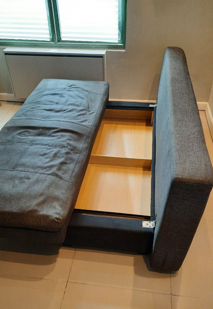 Sofabed with Storage (Category: Sofas) located in Quezon City. Submitted by new_and_good_as_new_items (Listing ID 1362996393, Image 3). Description: Fredrikstad Sofabed with Storage (Dark Gray) • Bought from Furniture Source Phils. • Product Dimensions: Length 195 cm Width 91 cm Height 89 cm Seat Height 41 cm Seat Depth 53 cm • 54 inches total depth when converted to bed. • bed feature not really used that much, this is why one side looks differe