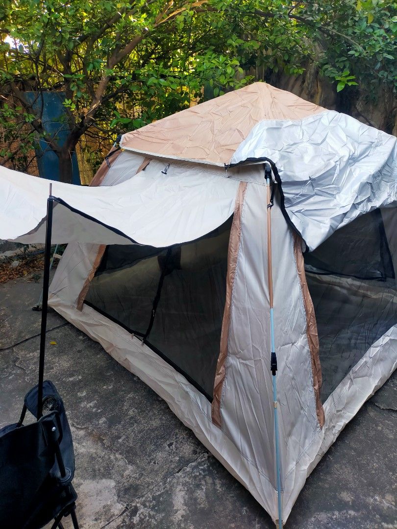 Camping Tent Waterproof Double Layer Tent Outdoor Camping Fully Automatic (Category: Hiking & Camping) located in Manila. Submitted by laluxury (Listing ID 1363141022, Image 3). Description: Nakapagcamping na ba ang lahat? Naghahanap ka ba ng matibay, maluwang, waterproof, 4 windows na magandang tent? Ito na ang sign para kulayan yan! Camping Tent Black and Khaki (215cm x 215cm x 142cm) ✅Brandnew ✅Good For 3 to 5 person ✅Automatic easy to set up 