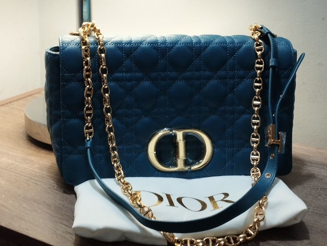 CD Caro Blue- Large (Category: Luxury Bags & Wallets) located in Rizal. Submitted by shoppin_craze (Listing ID 1363023457, Image 2). Description: Main composition: calfskin Lambskin and calfskin lining Flap closure with CD twist clasp Embossed 30 Montaigne signature on the back Adjustable, detachable CD chain link strap with Christian Dior Paris military-inspired buckle Two removable links with an X-shaped center notch allow the chain to be opene