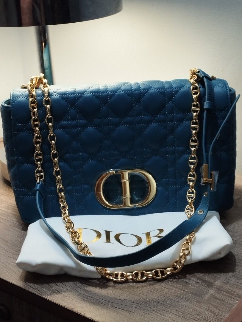 CD Caro Blue- Large (Category: Luxury Bags & Wallets) located in Rizal. Submitted by shoppin_craze (Listing ID 1363023457, Image 1). Description: Main composition: calfskin Lambskin and calfskin lining Flap closure with CD twist clasp Embossed 30 Montaigne signature on the back Adjustable, detachable CD chain link strap with Christian Dior Paris military-inspired buckle Two removable links with an X-shaped center notch allow the chain to be opene