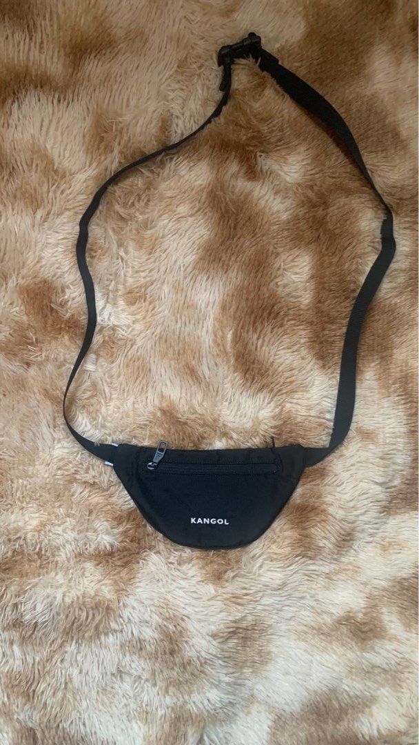Kangol Crossboy/Belt bag Original (Category: Belt bags, Clutches and Pouches) located in Quezon City. Submitted by gamitnirod (Listing ID 1363144124, Image 2). Description: Brand: Kangol (Original) Color: Black (Deep black in person) Issue: NONE! Pristine condition Other info: -Zippers are engraved with Kangol logo -Zippers are working smooth -Tags are complete -Very durable -Adjustable strap -2 pockets, 1 mesh pocket inside -Already washed and r