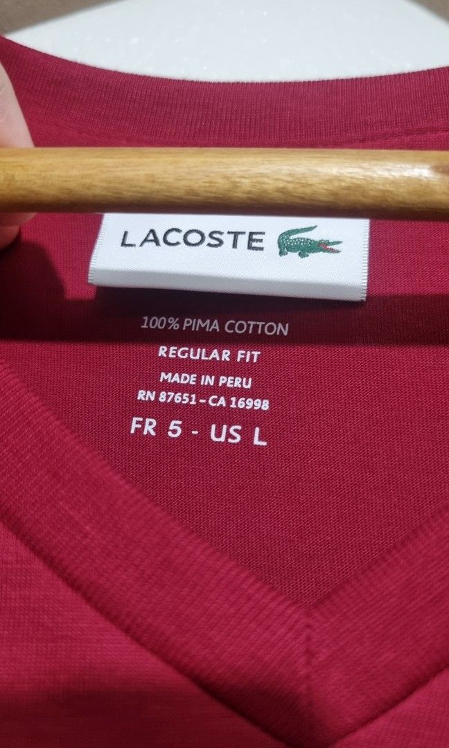 Lacoste Plain Shirt (Category: Tshirts & Polo Shirts ) located in Quezon City. Submitted by starrific (Listing ID 1363043196, Image 2). Description: Brand new, with tags Stocked in wardrobe, need washing V neck Regular fit, size 5 L RFS: Decluttering, size too big for my husband Location: QC, Manila.