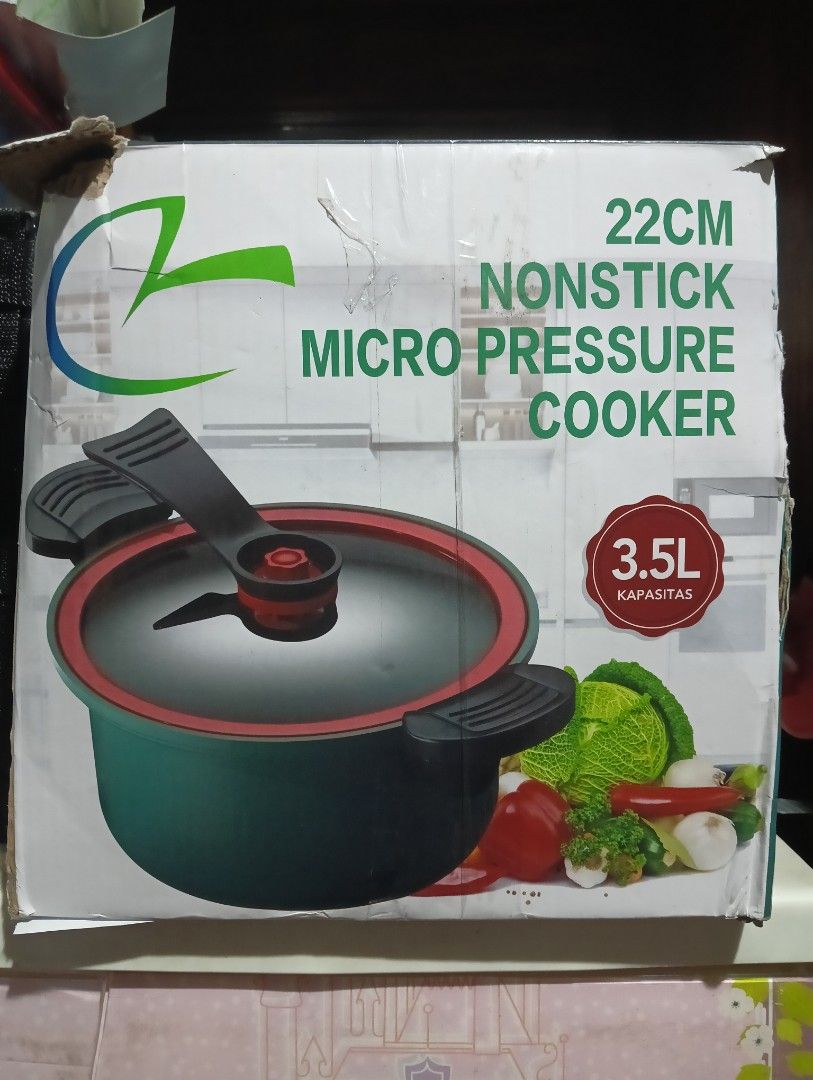 Micro pressure cooker (Category: Other Kitchenware & Tableware) located in Manila. Submitted by lulujoi (Listing ID 1363087824, Image 1). Description: brand-new never been used 22 cm non stick issue is nawawala ang turnilyo ng takip yung kulay red sa ibabaw pwede nyo naman bilhan and pwede din kayo gumagamit ng ibang takip sa bahay AS IS WER IS 9 INCHES YUNG LID.
