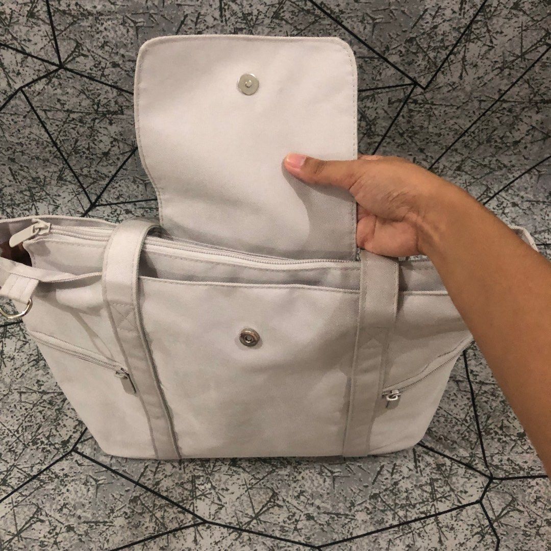 MURIOKI Nature Large Gray Tote Bag (Category: Tote Bags) located in Silang. Submitted by z__zene (Listing ID 1363143136, Image 3). Description: Bought for ₱850 selling it for ₱650 + SF - perfect for work/school - water repellent - can fit 15" laptop - has three pockets + laptop compartment inside - three pockets outside (two in the front, one in the back) - has a trolley strap - comes with detachable and adjustable crossbody strap - material is o