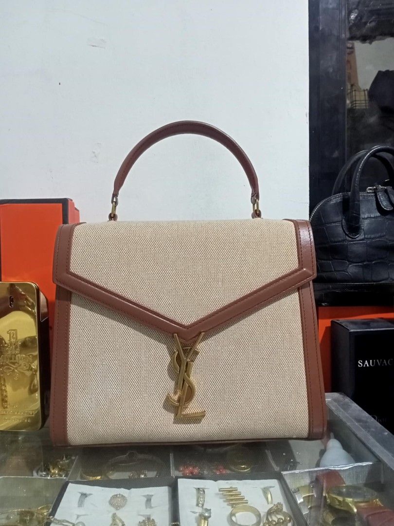 Yves Saint Laurent bag (Category: Luxury Bags & Wallets) located in Bayombong. Submitted by kweeeen (Listing ID 1363157969, Image 1). Description: For sale, YSL Cassandra top handle Medium sized bag Good condition Gold hardware All signs of authenticity are present in the bag Coded with sling.