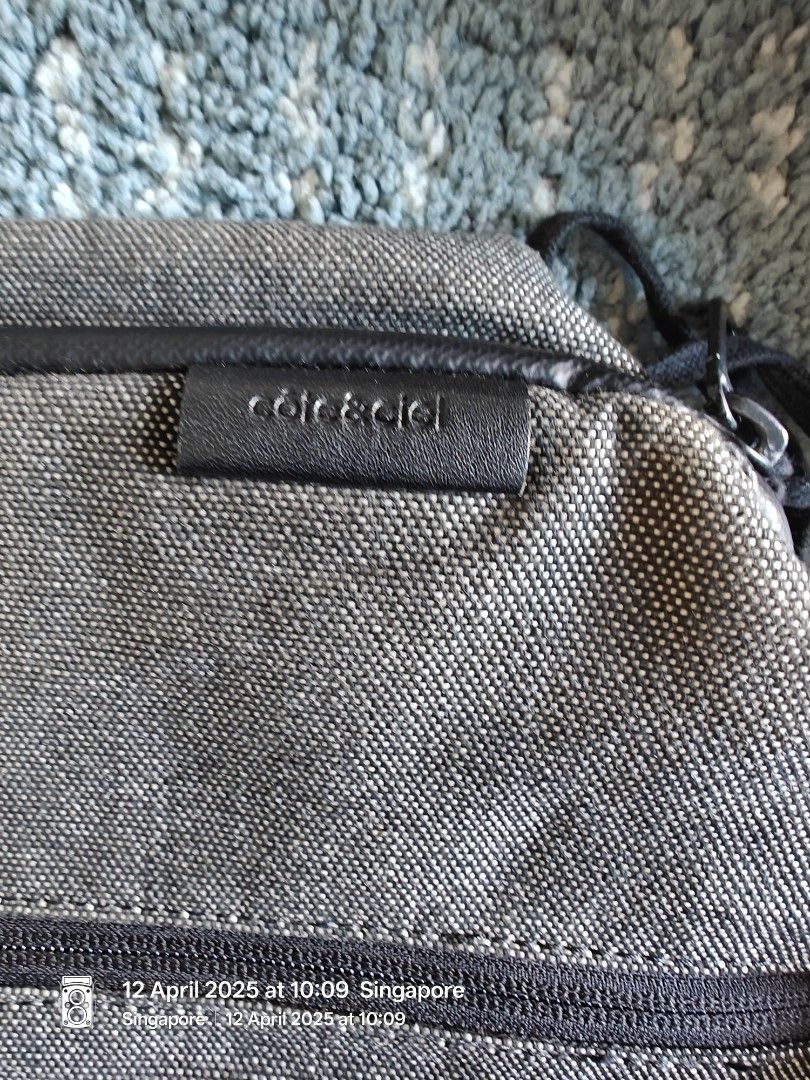 Cote & Ciel sling bag (Category: Bags & Wallets) located in Singapore. Submitted by bigbluesea (Listing ID 1363184587, Image 3). Description: A good condition Cote and Ciel sling bag made of water resistant canvas. Used less than 10 times and kept in cupboard. Minimal signs of wear, although some crumpled line may be visible due to storage. Overall still in nice condition. pickup at Anchorpoint mall or Queenstown MRT..