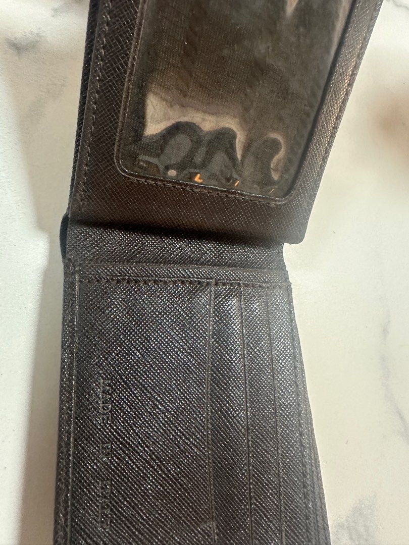 Prada wallet (Category: Luxury Bags & Wallets) located in Manila. Submitted by outofstock.ph (Listing ID 1363230779, Image 3). Description: Prada wallet authentic Minor flaw.