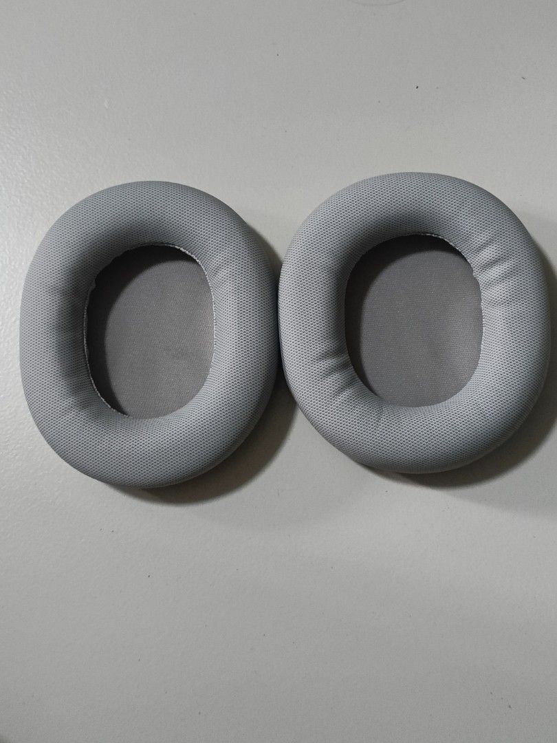 Headphone replacement ear pads (Category: Portable Audio Accessories) located in Singapore. Submitted by whatvr (Listing ID 1363445445, Image 1). Description: Doesn't fit mine so never used, brand new in silver/grey colour! Rough dimensions: 10.5cm (L) x 9cm (W) x 2cm (D).