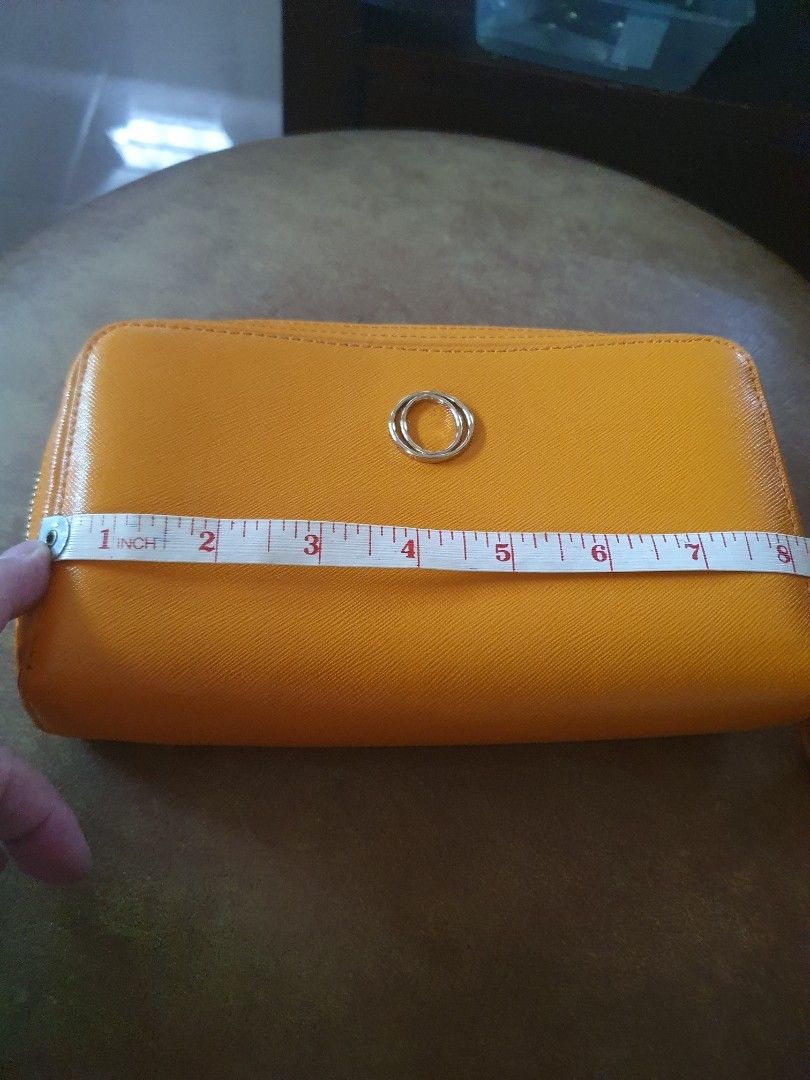 Oroton australia (Category: Luxury Bags & Wallets) located in Las Pinas. Submitted by marichelle1012 (Listing ID 1221195795, Image 3). Description: orange color & wristlet long wallet no flaws..malinis ang loob.