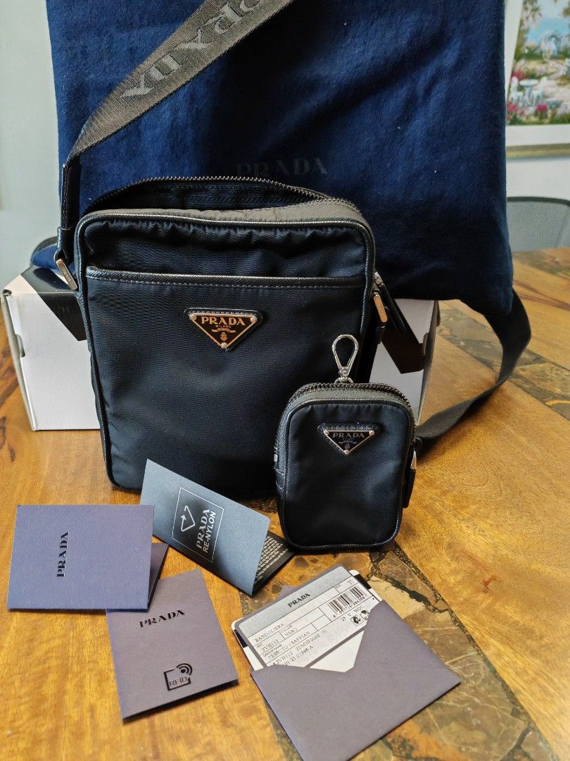 Prada RE nylon asaffiano Messenger Bag (Category: Luxury Bags & Wallets) located in Mandaluyong City. Submitted by brianallan (Listing ID 1363407318, Image 1). Description: Authentic Unisex Messenger Bag. Good as New. Seldom Used. Flawless.