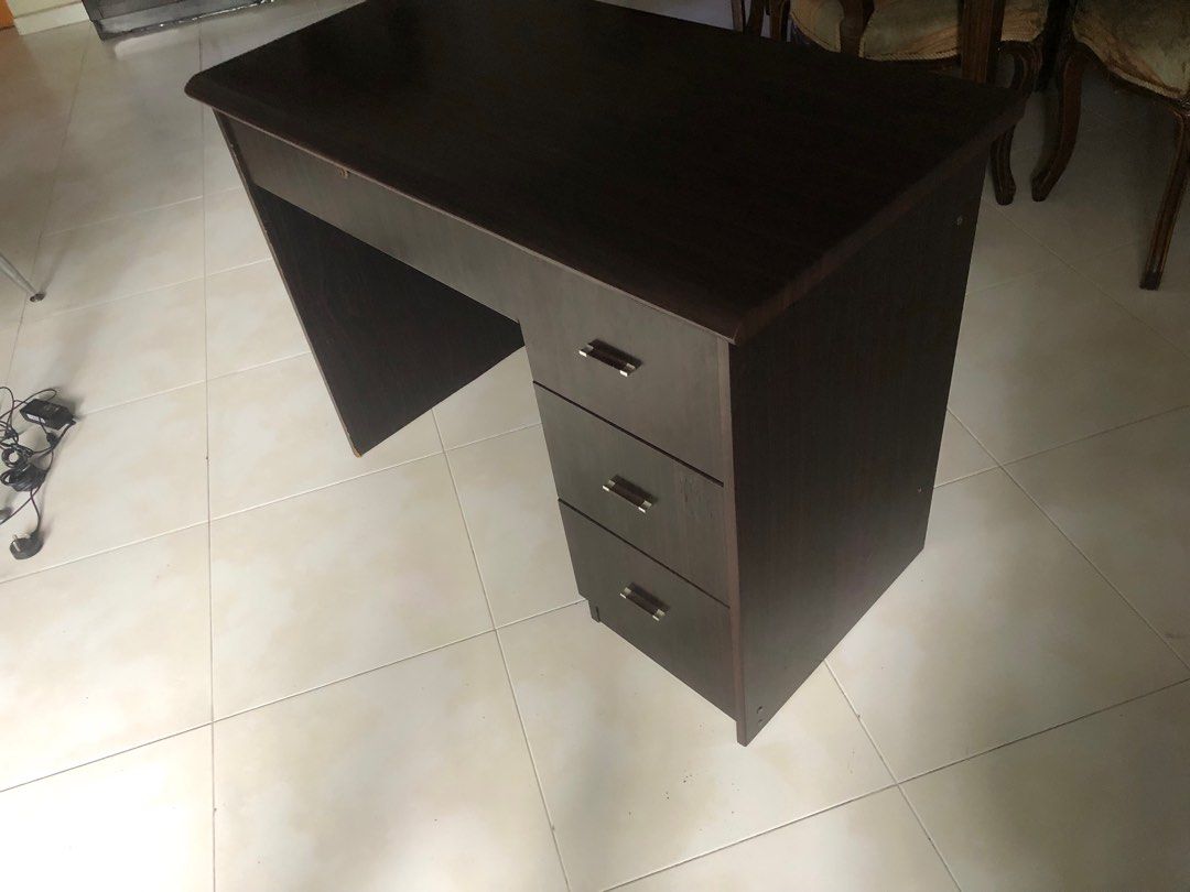 Study table (Category: Tables & Sets) located in Singapore. Submitted by user162473196 (Listing ID 1363436193, Image 2). Description: URGENT Small defect at the side but still in great shape.