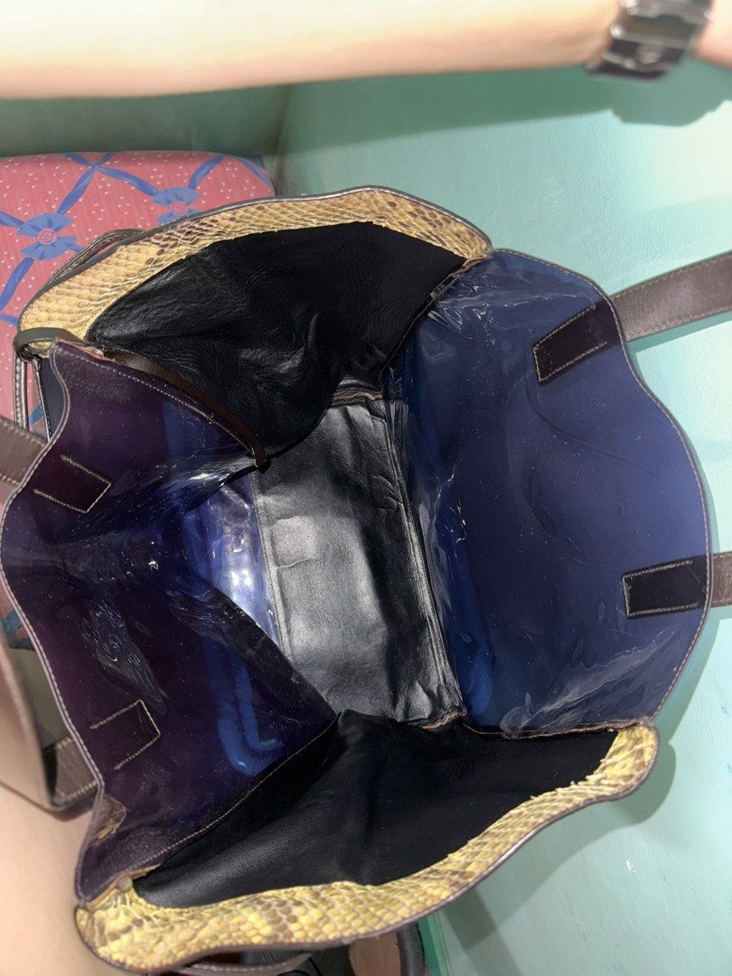 Auth Jil Sander Python/PVC Tote Bag (Category: Luxury Bags & Wallets) located in Cavite. Submitted by okaypreloved (Listing ID 1363700557, Image 3). Description: 2012 Runway Piece by Raf Simons for Jil Sander FLAWS Signs of usage Expired strap adhesive of pouch (ex pic 6) Expired Edge Seal of leather handles (ex pic 7) *PVC appears purplish *MEET-UP ONLY ALL SALES ARE FINAL AND NONRETURNABLE.