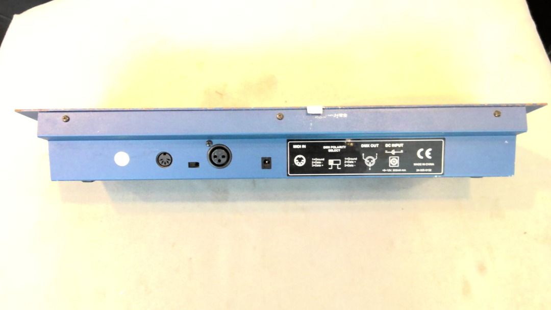 DMX Controller (Category: Lighting & Studio Equipment) located in Singapore. Submitted by prod00592 (Listing ID 1363612533, Image 2). Description: 8 sliders for control (page A/B) 8 programmable scenes in 30 banks 6 chases Input Voltage: DC 12V, 300 mA min .