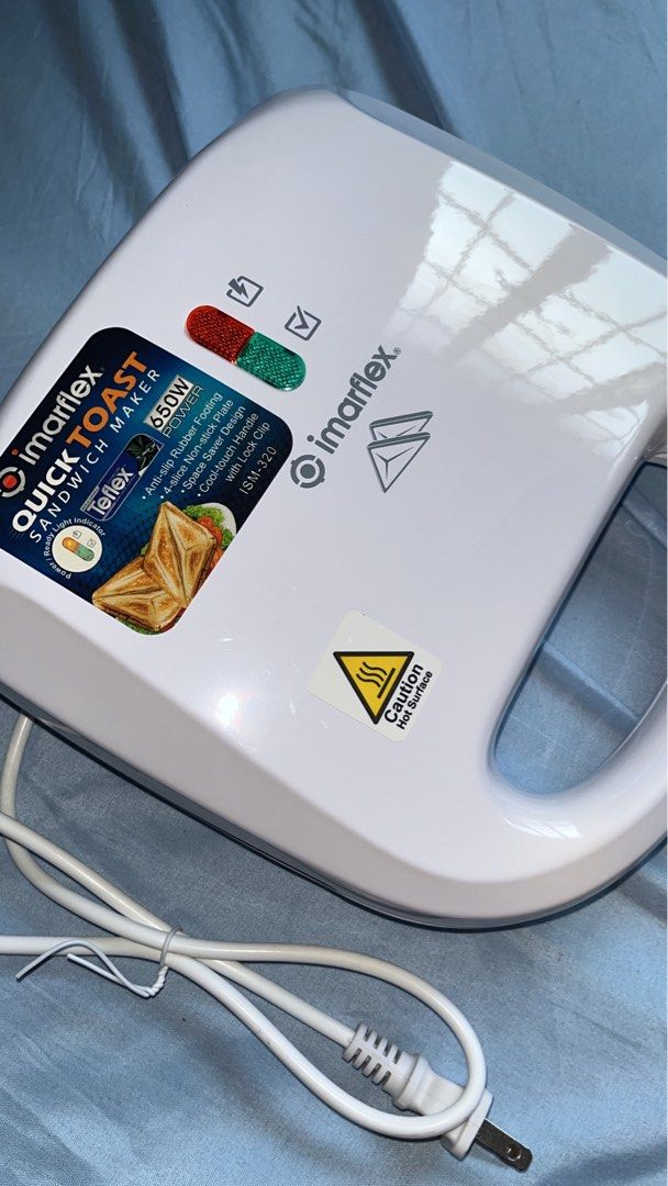 IMARFLEX QUICK TOAST SANDWHICH MAKER (Category: Ovens & Toasters) located in Manila. Submitted by margouxz (Listing ID 1363613985, Image 2). Description: -easy to heat -light indicator -non stick -with lock clip handle.