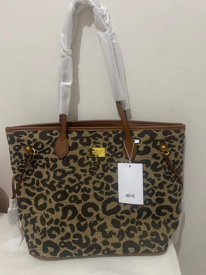Leopard Print Bag (Category: Tote Bags) located in Leyte. Submitted by declutterthis__ (Listing ID 1363686109, Image 1). Description: Brand New with tags. Perfect for work or school Fashion brand but good quality and nice stitches. PM for more photos..