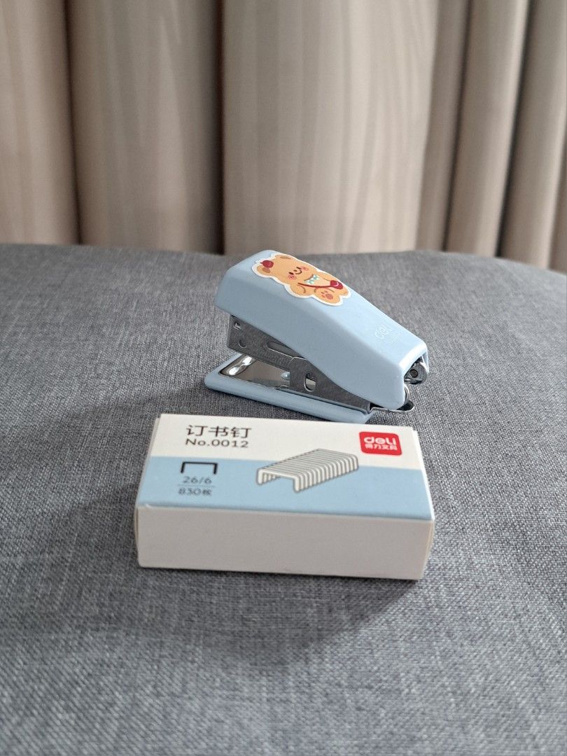 Mini stapler (Category: Stationery & School Supplies) located in Singapore. Submitted by marshbreado (Listing ID 1363609134, Image 1). Description: Never used before. Comes with 1 box of refills.
