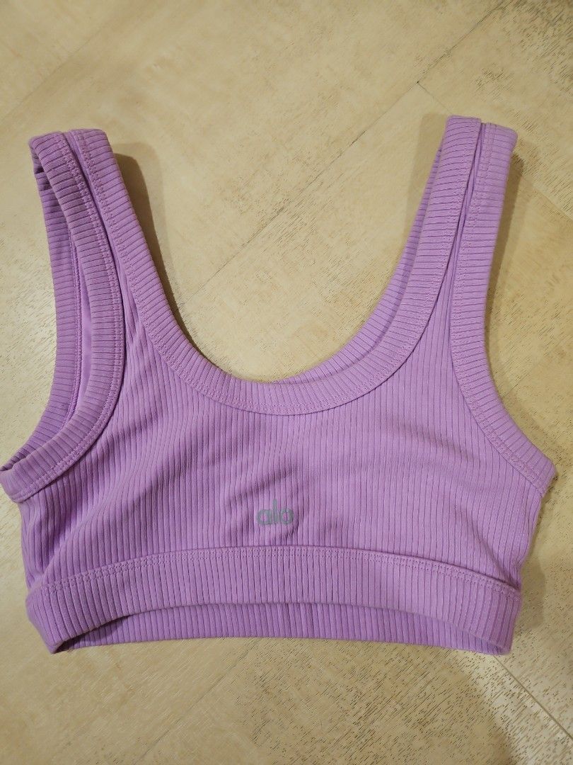 Alo Yoga wellness bra XS (Category: Activewear) located in Singapore. Submitted by missyytt (Listing ID 1363836184, Image 2). Description: Done in a soft, substantial ribbed fabric with removable cups, the Wellness Bra offers support for everything from hot girl walks to heated Pilates. With a scoop neck, wide straps and a rib-grazing hem, you’ll find yourself reaching for this classic look on repeat. I don't really reach out for these. more colo
