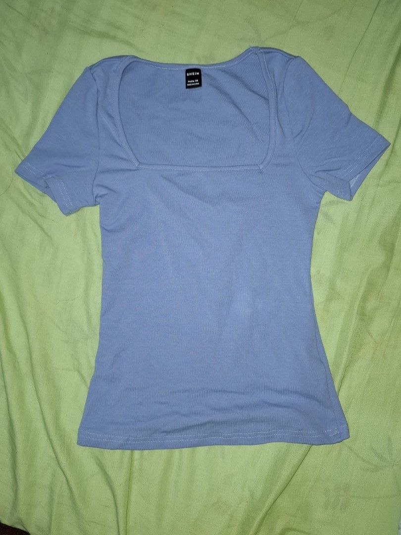 Blue Square Neck Short Sleeve Top (Category: Blouses) located in Quezon City. Submitted by diane.99 (Listing ID 1363836179, Image 1). Description: Used once. Bought for 150 Pesos. Surprisingly, material is not thin for SHEIN quality Rfs: Cute sana kaso I ordered the item too small. Kasya naman kaso I have broad shoulders kasi. Should've gotten a size bigger XS on tag.