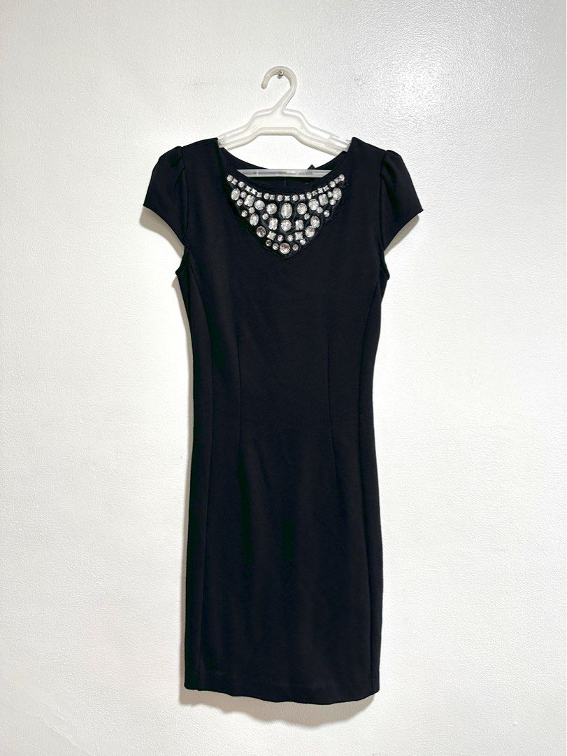 Mango Embellishment Black Dress (Category: Dresses) located in Makati City. Submitted by charm_style_items (Listing ID 1363788156, Image 1). Description: Brand: Mango • Size: XS • Color: Black • Style: Classic sheath dress • Details: • Eye-catching rhinestone embellishment on the neckline • Subtle puff sleeves • Sleek, curve-skimming silhouette • Concealed back zip closure • Condition: Excellent used condition • Perfect for: Office parties, cockt