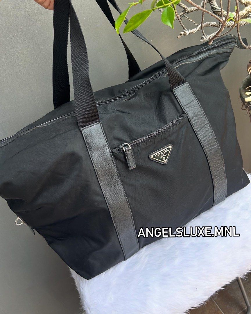 PRADA Tessuto Nylon Weekend Bag (Category: Luxury Bags & Wallets) located in Pasig City. Submitted by angelsluxe.mnl (Listing ID 1363819825, Image 1). Description: Size : 15x24x7 inches ☑️ Comes with Authenticity Guarantee Card. ☑️We offer full refund of item if proven not authentic by professional authenticators (not by anybody’s opinion). ☑️Manage expectations when buying preloved items as there may be normal signs of use. All major flaws are d