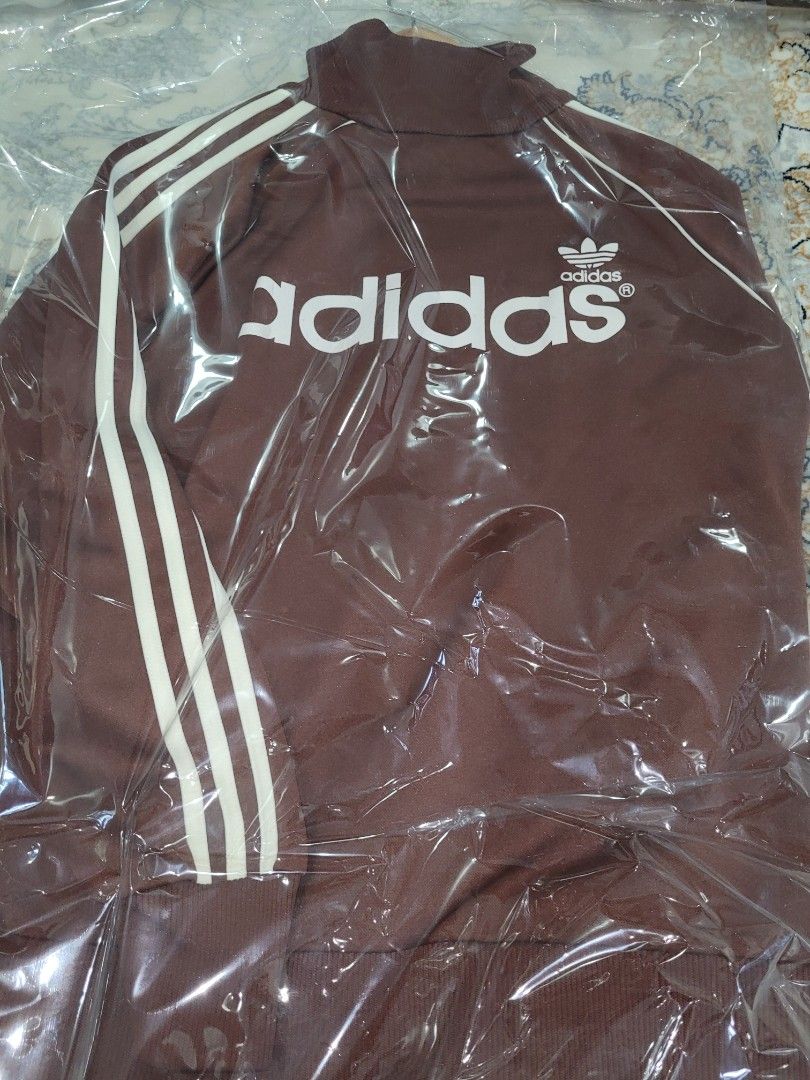 Adidas Jacket (Category: Activewear) located in Singapore. Submitted by ADIDASMUSEUM (Listing ID 1363935621, Image 3). Description: a brown with cream stripes Adidas vintage tracktop jacket still in pristine condition. a must have for vintage collectors..