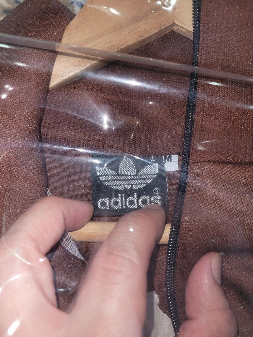 Adidas Jacket (Category: Activewear) located in Singapore. Submitted by ADIDASMUSEUM (Listing ID 1363935621, Image 2). Description: a brown with cream stripes Adidas vintage tracktop jacket still in pristine condition. a must have for vintage collectors..