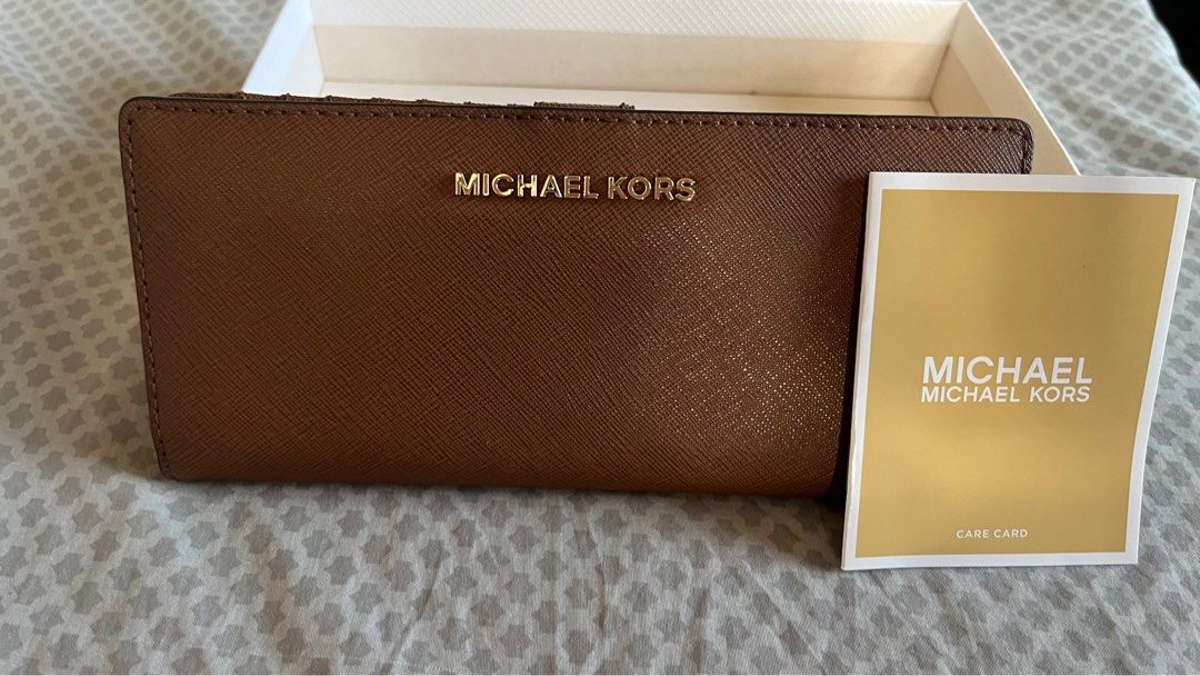 Brand new Michael Kors wallet (Category: Luxury Bags & Wallets) located in Bacoor. Submitted by mcyzon (Listing ID 1364058042, Image 1). Description: Brand new Michael Kors wallet Color: Brown Bought in the US Rfs: too many wallets.