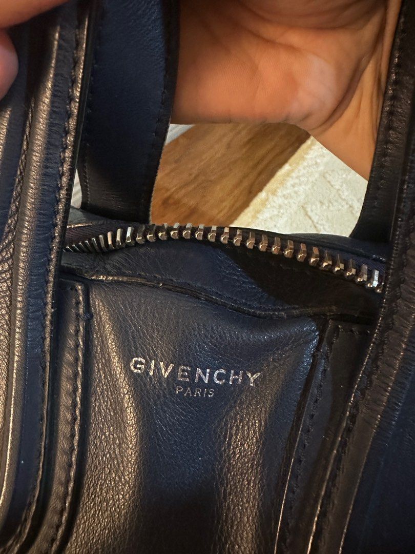 Givenchy Nightingale (Category: Luxury Bags & Wallets) located in San Fernando. Submitted by miss_peng (Listing ID 1364027768, Image 3). Description: GIVENCHY NIGHTINGALE LARGE LEATHER SATCHEL YEAR: 2015 HARDWARE: Silver Tone CLOSURE: Top zip INTERIOR: Fabric lining with zip pocket and slip pockets INCLUDES: Bag & dust bag Condition: Gently used with minor creasing Interior has a few ball pen marks and stains .