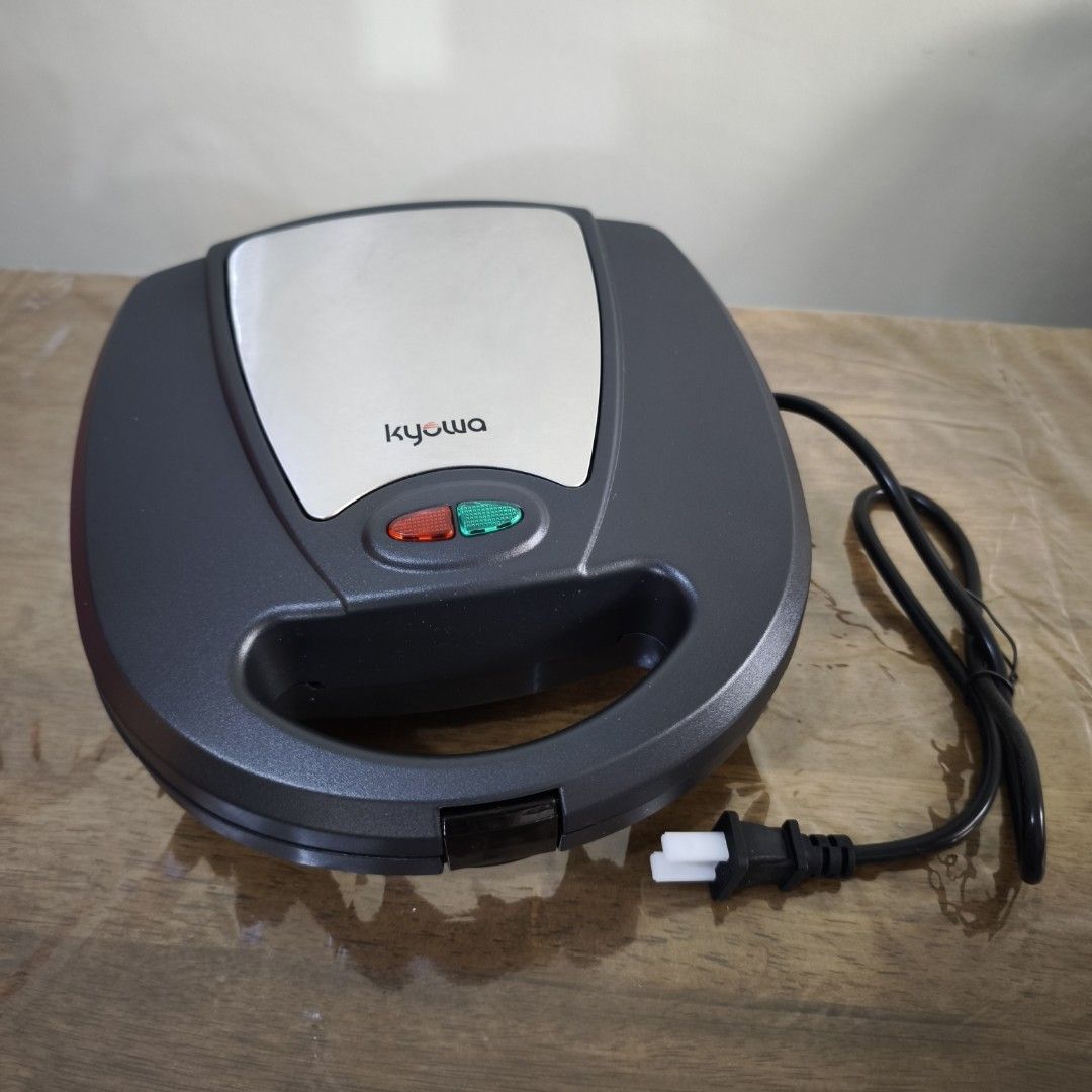 KYOWA Pancake and Burger Maker (Category: Other Kitchen Appliances) located in Manila. Submitted by siopao0130 (Listing ID 1364001917, Image 1). Description: Kyowa Pancake and Burger Maker - original price at Php850 - BRANDNEW BRANDNEW - Power and heat indicator - 2 slots nonstick cooking surface - locking lid for easy storage - prepares 2 pancakes at once - preset temperature - nonstick surface for easy cleaning - Bakelite cool touxh housing - l