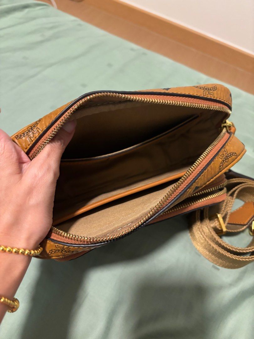 MCM Sling Bag (Category: Bags & Wallets) located in Singapore. Submitted by mehmeh176 (Listing ID 1364018493, Image 2). Description: I got it from another Carousell seller. But didn’t get to use it. I find it too small. Other than the side of the pocket there is a bit of worn out. The bag is in a good condition .
